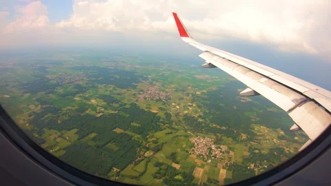 Beautiful view of airplane window overlooking city of India Stock Footage 293412228