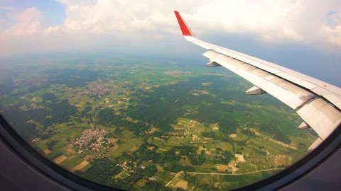Beautiful view of airplane window overlooking city of India Stock Footage 293412238
