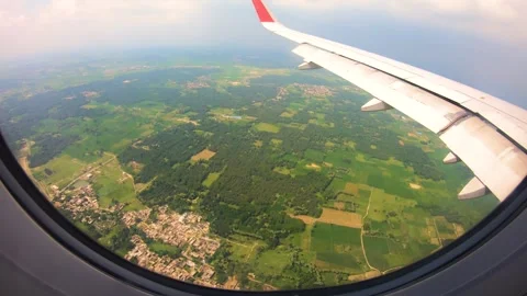 Beautiful view of airplane window overlooking city of India Stock Footage 293412284