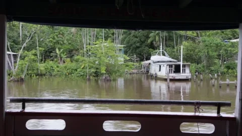 Beautiful view of Amazonas River bank village through wooden boat window Stock Footage 190624518