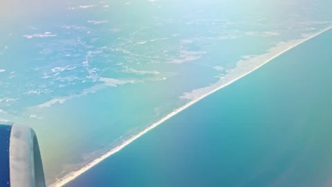Beautiful view of Atlantic Ocean coastline from airplane window during flight. Stock Footage 341237506