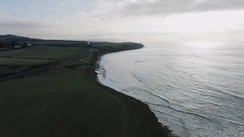 A beautiful view of a beach with a cliff in the background Video stock 298251805