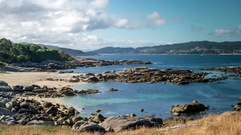 Beautiful View of a beach full of rocks in the day Stock Footage 140935131