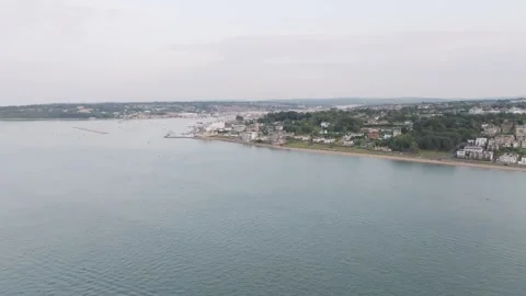 A beautiful view of a beach with a small town in the background Stock-Footage 297950060