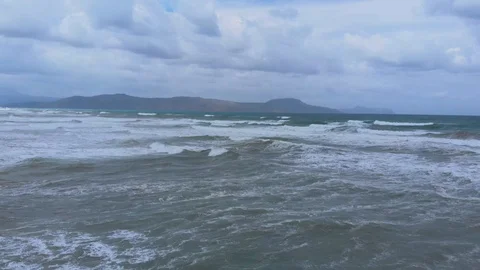 Beautiful view of big waves on ocean beach. Strong wind. Stock Footage 119789967