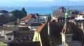 Beautiful view of blue Lake Geneva, red roofs and Gothic spires in Lausanne HD Footage