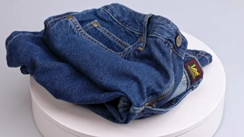 Beautiful view of blue LEE denim skirt on rotating disc. Stock Footage 252757151