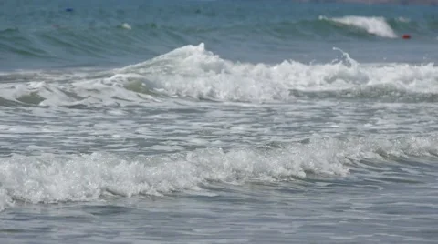 Beautiful view of blue sea waves breaking on summer beach. Slow motion Stock-Footage 50600216