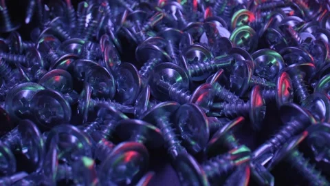 Beautiful view of a bunch of small screws in the dark background. Fastening Stock Footage 159493147