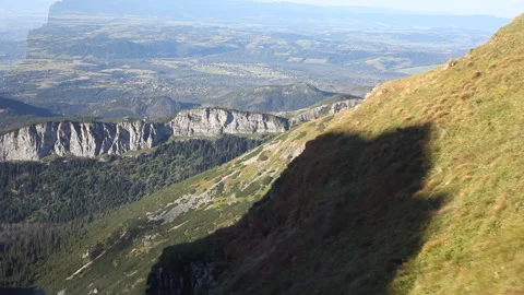 Beautiful view from the cabin of the cableway to the mountain ranges and cliffs. Video stock 121485738