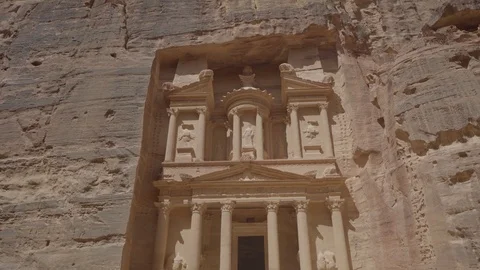 Beautiful view of a camera moving backward from the door in the rock in petra Stock Footage 102779024