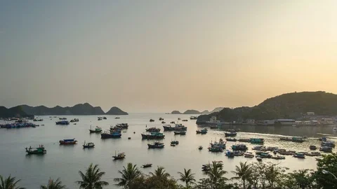 Beautiful view on the Cat Ba Bay from the island at dusk. TImelapse of boats Stock Footage 126767359