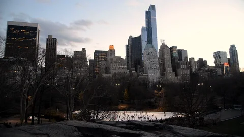 Beautiful view in Central Park looking down at people ice skating below Stock Footage 99421501