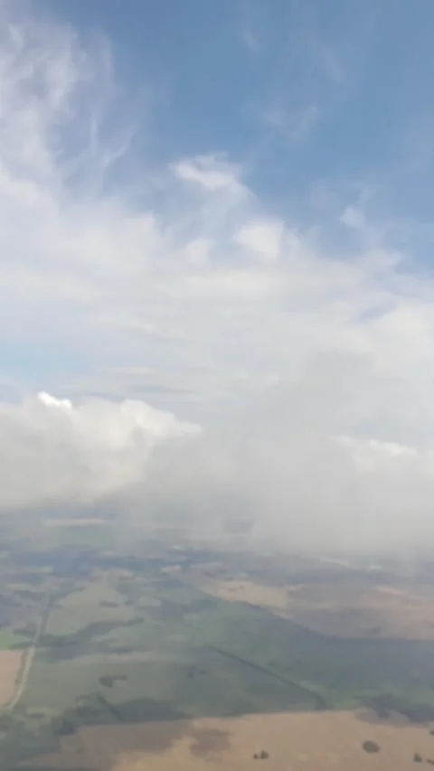 Beautiful view of clouds and earth from the airplane window. Stock Footage 320284416