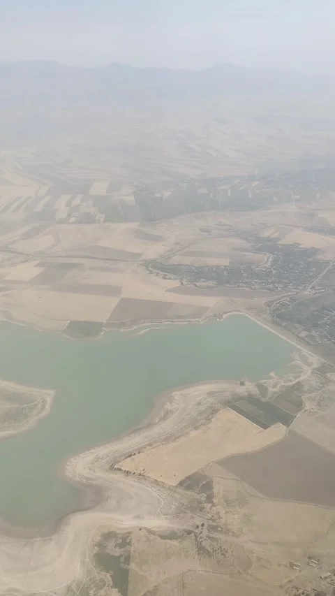 Beautiful view of clouds and earth from the airplane window. Stock Footage 320284420