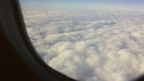 Beautiful View of The Clouds from a Plane Window Stock Footage 89769716