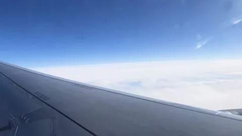Beautiful view of the clouds through the porthole. View from the window of the Stock Footage 201153094