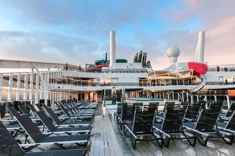 Beautiful view of deck with rows of sun loungers from MSC WORLD EUROPA cruise Stock Photos