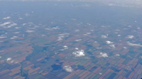 Beautiful view of the earth with clouds from the porthole of the plane during 库存影片 79957163