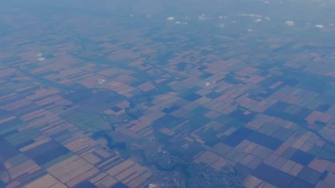 Beautiful view of the earth with clouds from the porthole of the plane during 库存影片 79960547