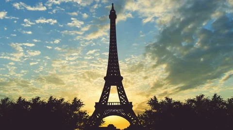 Beautiful view of the Eiffel Tower against the background of sunset. Time lapse Stock Footage 64263366