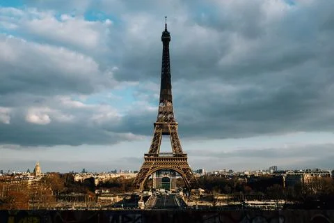 Beautiful view of the Eiffel tower in daytime against a cloudy sky in Paris ,Fra Stock Photos