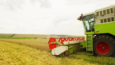 A beautiful view of endless fields of wheat cultivated by large machinery. Stock Footage 253987586