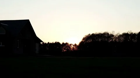 Beautiful view evening sunset sky on background country house in village Video stock 81694078