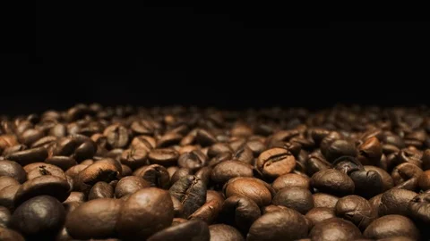 Beautiful View Of Falling Coffee Beans. Close-up. Stock Footage 108800558
