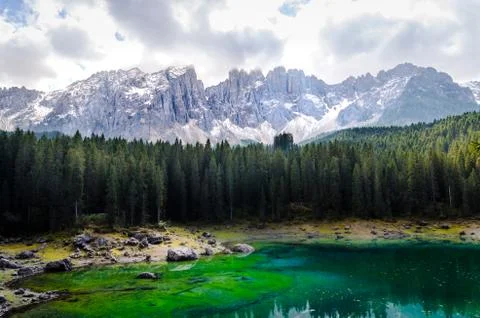 Beautiful view of famous Carezza lake at dolomite mountain, Italy. Stock Photos