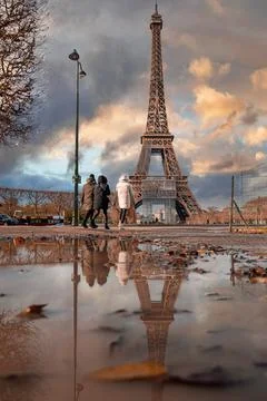 Beautiful view of the famous Eiffel Tower in Paris, France during magical sunset Stock Photos