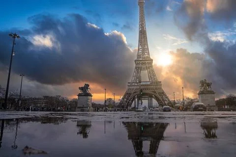 Beautiful view of the famous Eiffel Tower in Paris, France during magical sunset Stock Photos