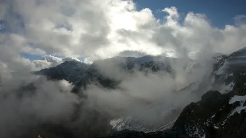 Beautiful View Of Fast Rolling Clouds Over A Mountain Stock Footage 168288671