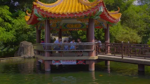 Beautiful view of fish pond with small central pagoda at Kek Lok Si Temple Stock Footage 108795960