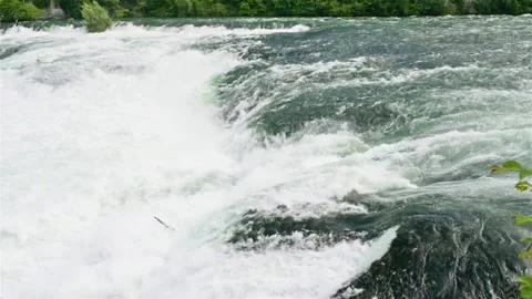 A beautiful view of a flowing, powerful waterfall. Waterfall on the river Rhine. Stock Footage 111522516