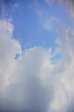 Beautiful view of fluffy white clouds in the bright blue sky during daytime. Photos