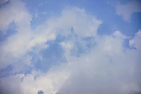 Beautiful view of fluffy white clouds in the bright blue sky during daytime. Photos