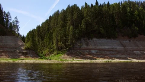 Beautiful view of forest and steep coast river in summer Stock Footage 72468974