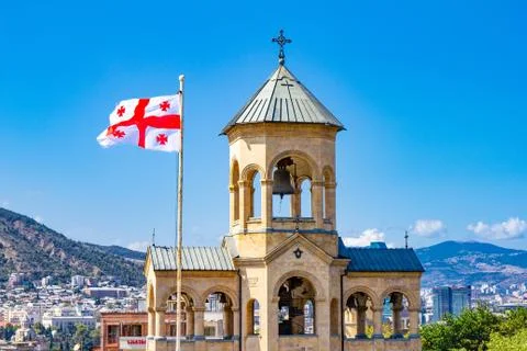 Beautiful view to Georgian Flag on the background chapel on site to Sameba Ca Stock Photos