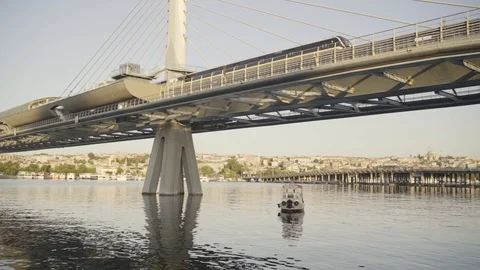 Beautiful view to the Halic bridge from the sea, on sunrise rays Stock Footage 123836724