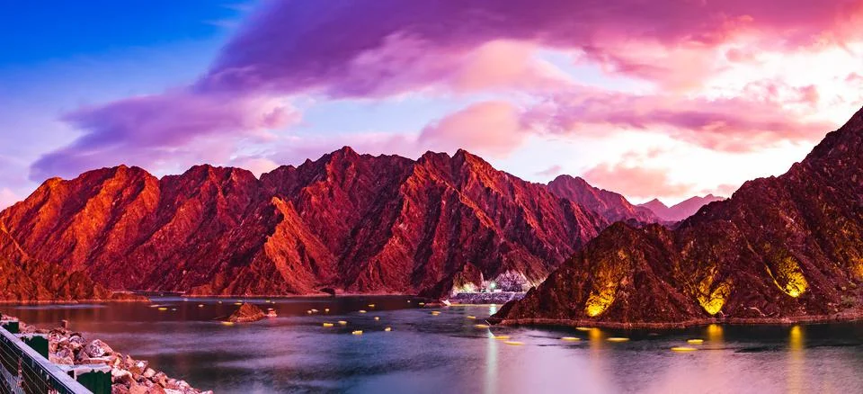 Beautiful view of Hatta Dam or Lake and Hajar Mountain in the Emirate of Dubai. Stock Photos