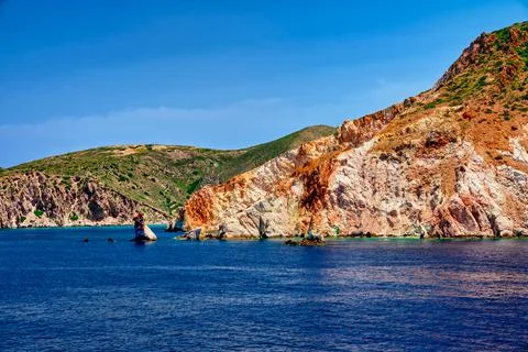 Beautiful view of high hill slope of island in Mediterranean Sea. Blue waters Stock Photos