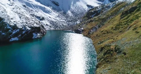 A beautiful view of a high-mountain lake in a picturesque gorge of the Caucasus Stock Footage 163313581