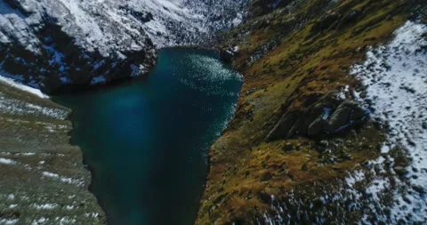 A beautiful view of a high-mountain lake in a picturesque gorge of the Caucasus Stock Footage 163313652
