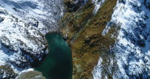 A beautiful view of a high-mountain lake in a picturesque gorge of the Caucasus Stock Footage 163313686