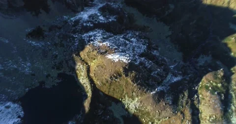 A beautiful view of a high-mountain lake in a picturesque gorge of the Caucasus Stock Footage 163314499
