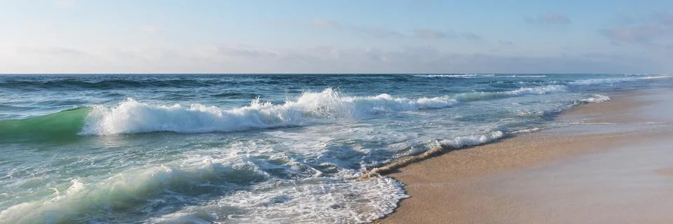 Beautiful View on high waves on the empty coast of the Atlantic Ocean. Deserted Stock Photos