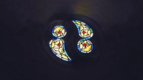 Beautiful view inside a cathedral seeing the colourful stained glass Stock Footage 67317387