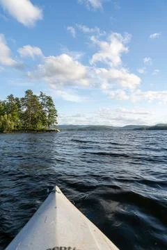 A beautiful view looking out from a kayak on Conway Lake in New Hampshire. Stock Photos