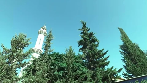 Beautiful view of the minaret through the trees. Stock Footage 78989577